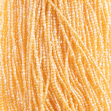 Load image into Gallery viewer, Czech Seed Bead 3Cut 10/0 Transparent Medium Topaz Luster Strung
