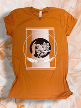 Load image into Gallery viewer, (Adult) “Gathering” Orange T-Shirt by Madelaine McMillan