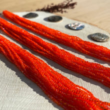 Load image into Gallery viewer, Czech Seed Bead 3Cut 10/0 Transparent Orange Luster Strung
