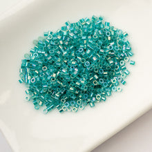 Load image into Gallery viewer, 11/0 Cylin Bead Transparent Teal Caribbean AB

