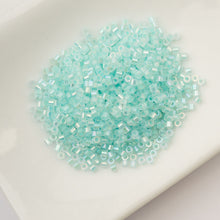 Load image into Gallery viewer, 11/0 Cylin Bead Glow in Dark AB - Turquoise
