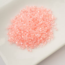 Load image into Gallery viewer, 11/0 Cylin Bead Glow in Dark AB - Coral
