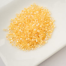 Load image into Gallery viewer, 11/0 Cylin Bead Glow in Dark AB - Gold Yellow
