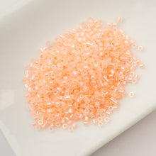 Load image into Gallery viewer, 11/0 Cylin Bead Glow in Dark AB - Orange
