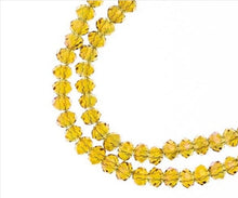 Load image into Gallery viewer, Rondelle 3x4mm Transparent Light Amber with Purple Luster
