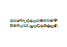 Load image into Gallery viewer, Bicone 2 Strand 7"- 4mm Opaque Blue with Half Champagne Luster
