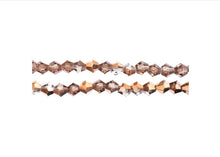 Load image into Gallery viewer, Bicone 2 Strand 7"- 4mm Transparent  Crystal with Half Copper Iris
