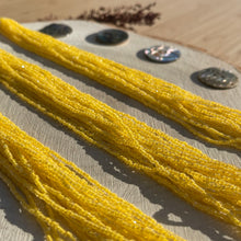 Load image into Gallery viewer, Czech Seed Bead 3Cut 10/0 Crystal/Yellow Strung
